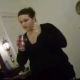A girl follows her chubby friend into the bathroom as she pees on the toilet and films the entire event.